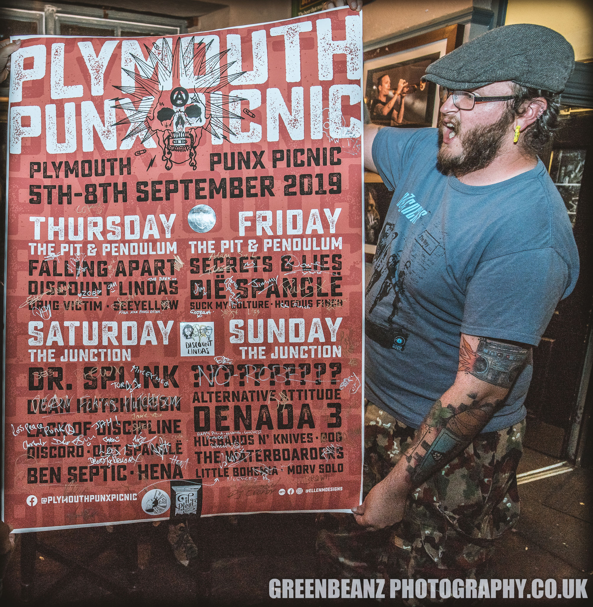 Jack Hopkins Event Organiser of 2019 's Plymouth Punx Picnic with the signed line up poster at The Junction